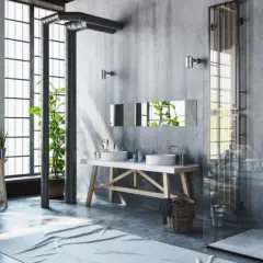 Badezimmer im bad industrielook mit Betonwänden, freiliegenden Rohren, einer Metallbadewanne und Pflanzen.