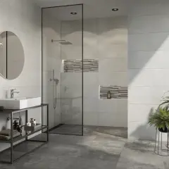 Modernes Bad mit Dusche, Waschbecken und Pflanzen. Die Wandfliesen mit Betonoptik verleihen dem Raum einen industriellen Touch.