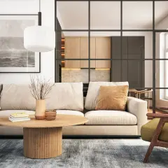 Gemütliches Wohnzimmer mit beigem Sofa, Holztisch und Blick in eine moderne Küche. Neue Wohntrends für ein stilvolles Zuhause.