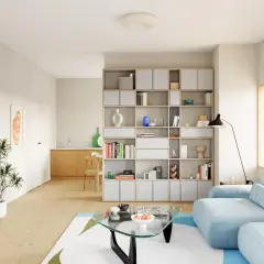 Helle, moderne Wohnung mit einem großen Bücherregal, einem blauen Sofa und einem Glastisch. Perfekte Wohnung Inspo für minimalistisches Design.