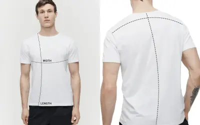 Mann mit weißem T-Shirt, das mit gestrichelten Linien für Breite und Länge markiert ist. So ermitteln Sie, wie lang sollte ein T-Shirt sein.