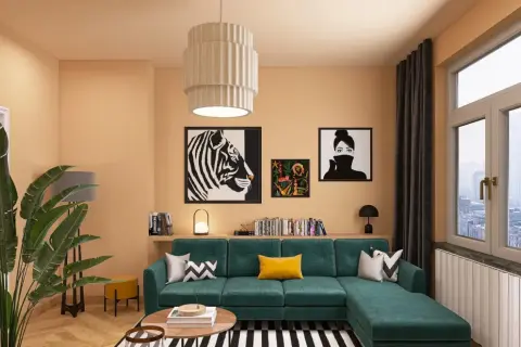 Gemütliches Wohnzimmer mit smaragdgrünem Sofa, auffälligen Kunstwerken und warmen Farbkombinationen an der Wand.