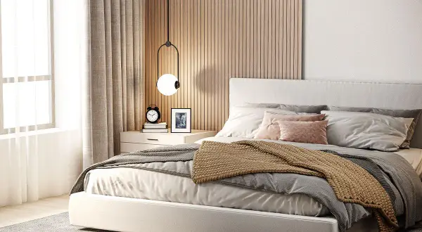 Gemütliches Schlafzimmer mit Holzakzenten an der wandfarbe hinter bett. Helle Bettwäsche und ein warmer Überwurf laden zum Entspannen ein.