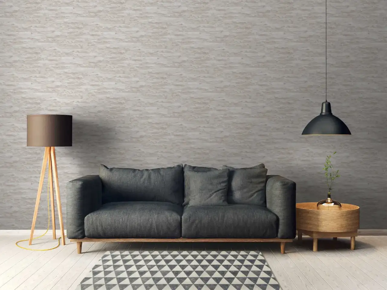 Modernes Wohnzimmer mit grauem Sofa, Stehlampe und Beistelltisch. Die Wand ist mit einer Tapete mit Steinoptik tapeziert, tapezieren ohne kleister ist hier die L&ouml;sung.